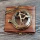 Brass Pocket Compass Displayed on Wooden Box